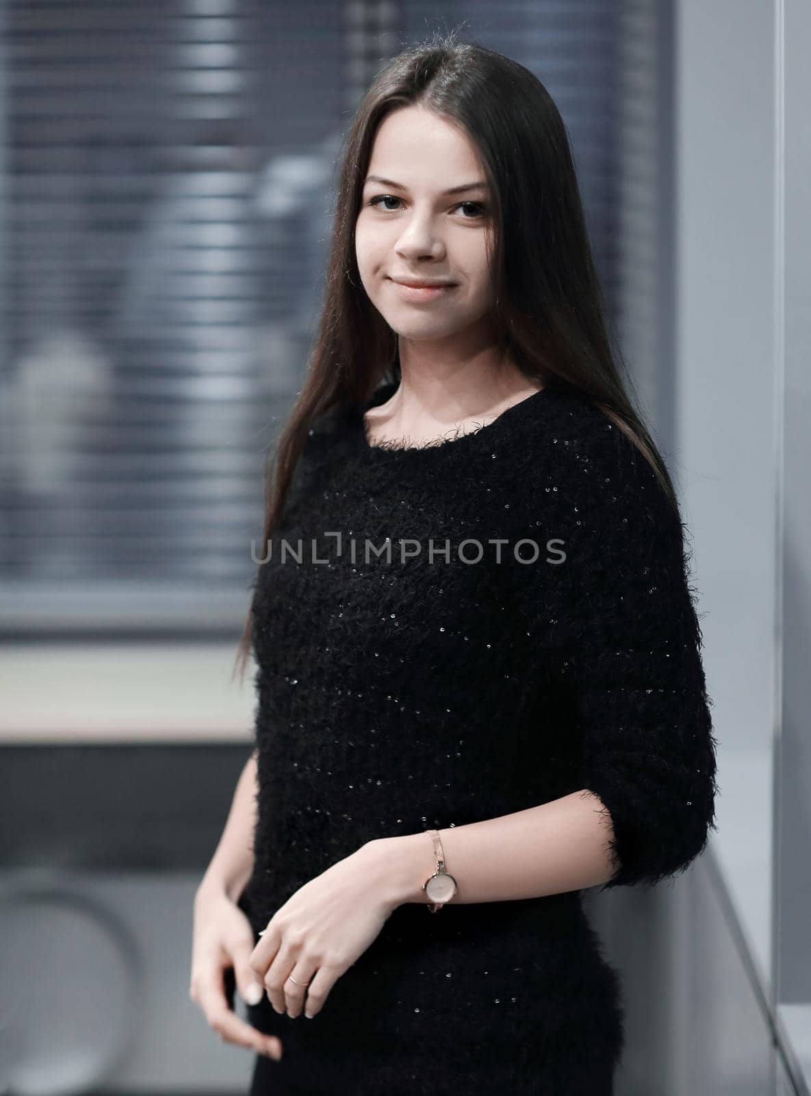 young employee standing near the window in the office.photo with copy space