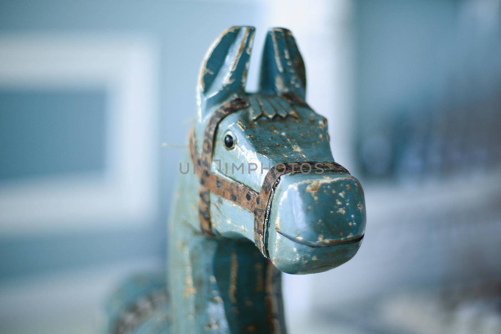 closeup.wooden horse on the background of a child's room.photo with copy space
