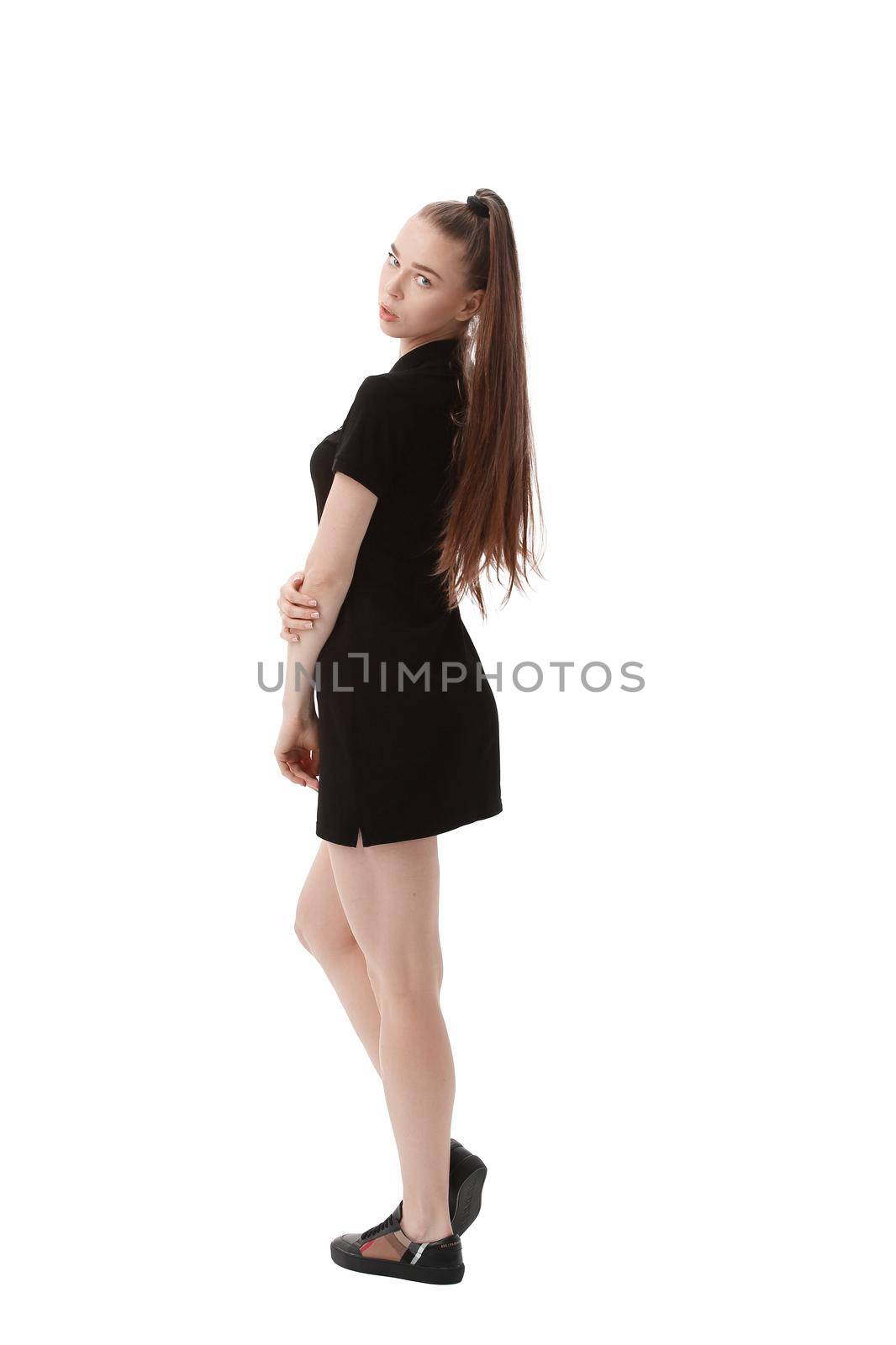 rear view.beautiful woman model in short black dress .isolated on white.