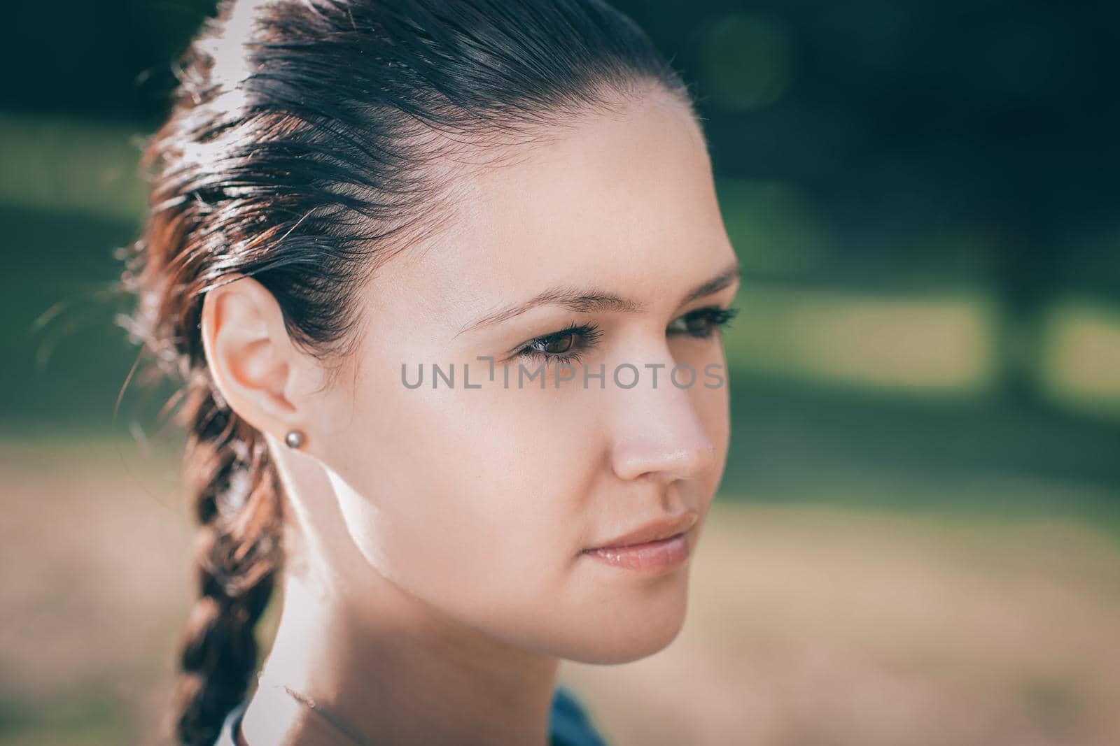 close up. attractive young woman looking off into the distance