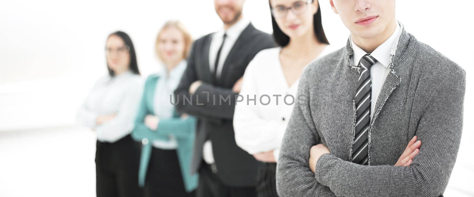 young businessman standing in front of his business team.photo with copy space