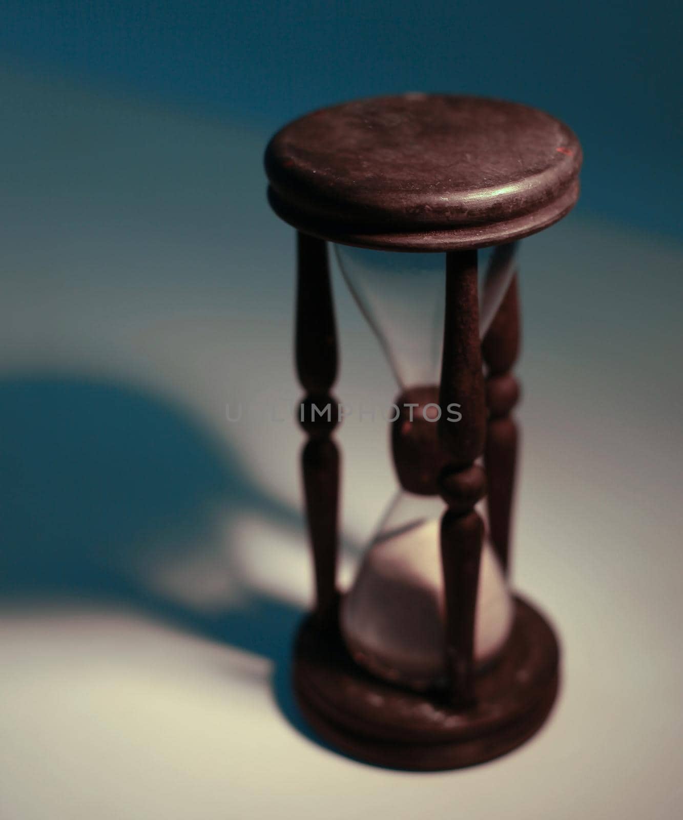 closeup.hourglass on a yellow background.The concept of time.