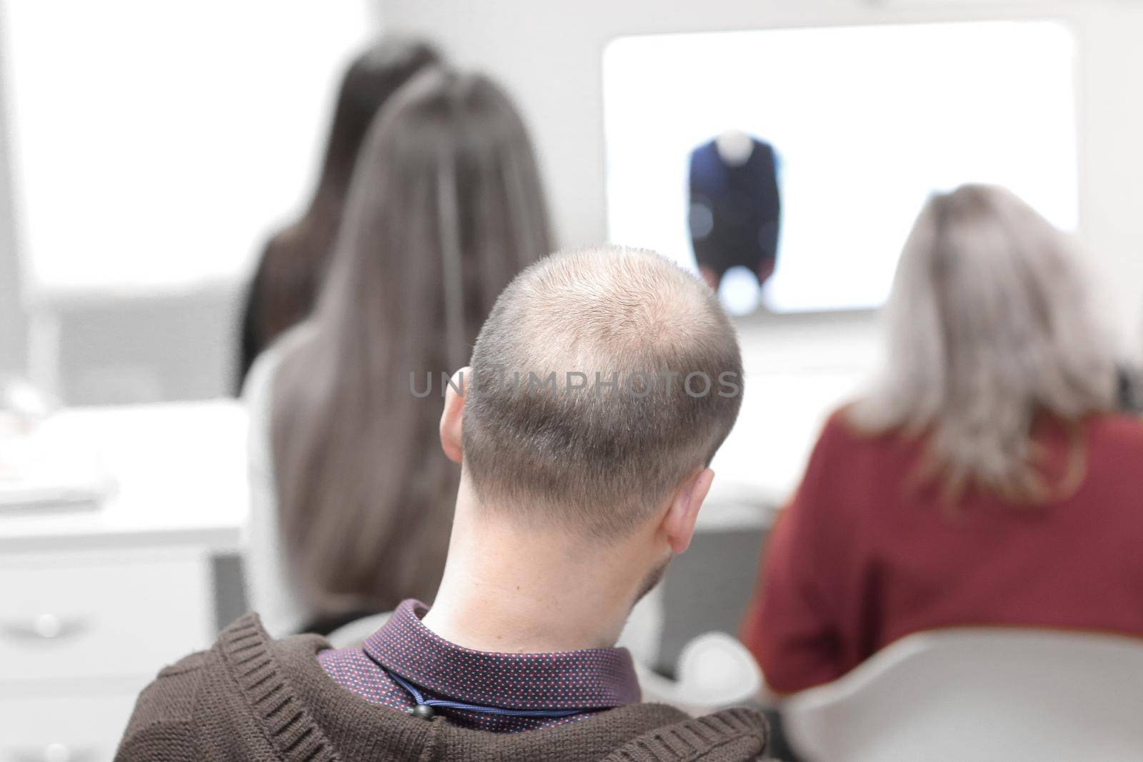 rear view.blurred image of people in the conference room.business background