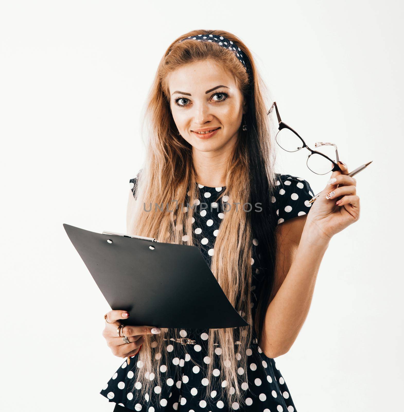 portrait of confident female administrator in glasses with papers on white background. the photo has a empty space for your text