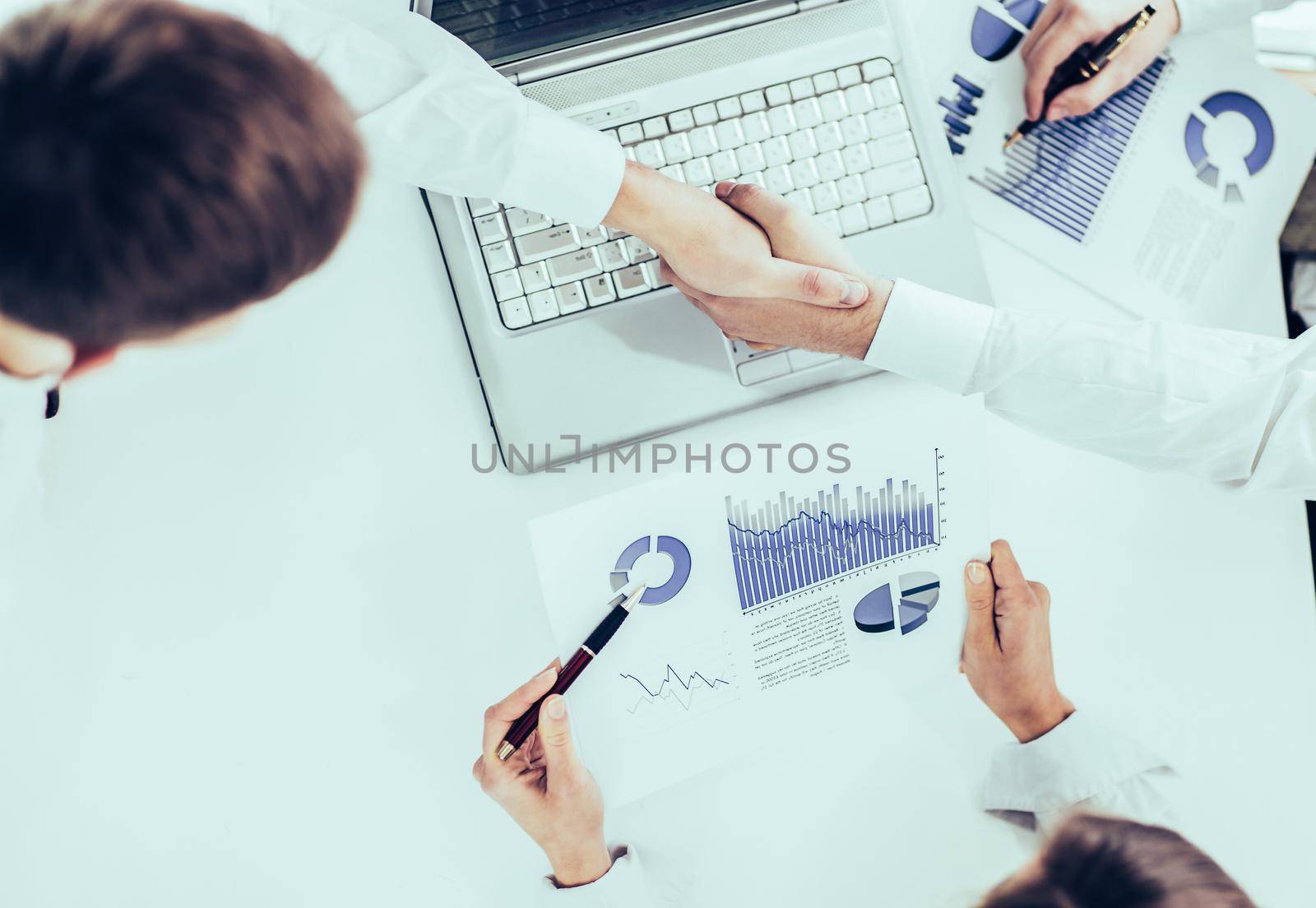 closeup of business team using digital tablet, working with the financial schedule of the company's development