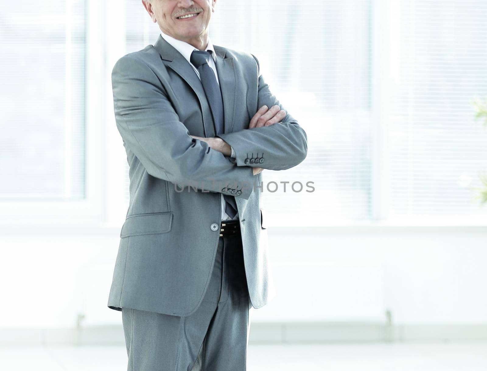 portrait of a successful Mature businessman in modern office photo with copy space