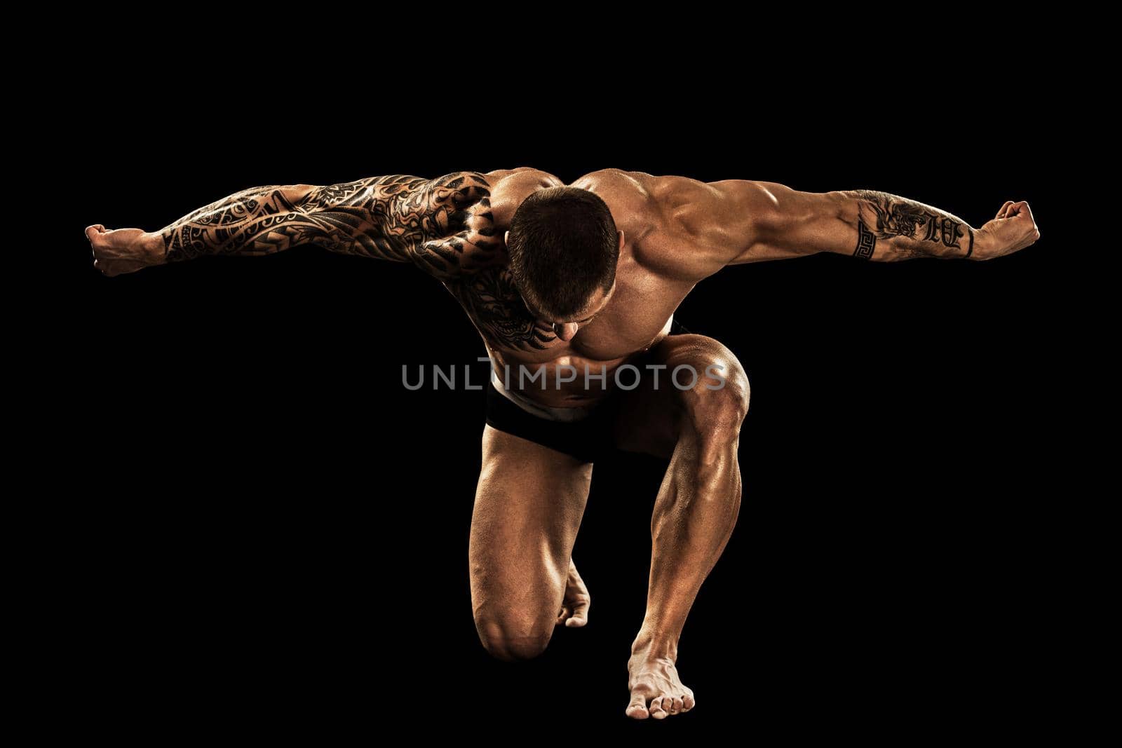 bodybuilder posing. Beautiful sporty guy male power. Fitness muscular body.