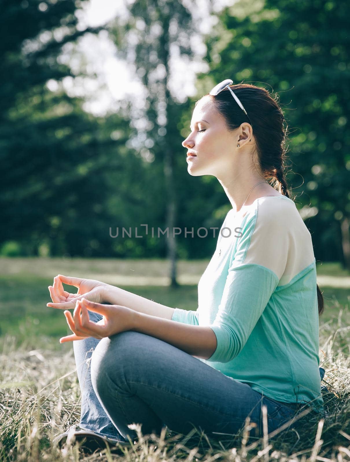 side view.beautiful woman meditating in Lotus position outdoors. the concept of calm and meditation