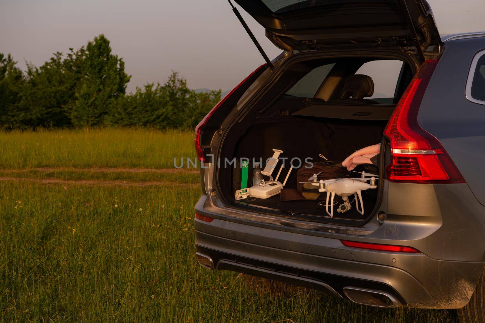 drone ready for fly in suv trunk landscape nature mountains sunset