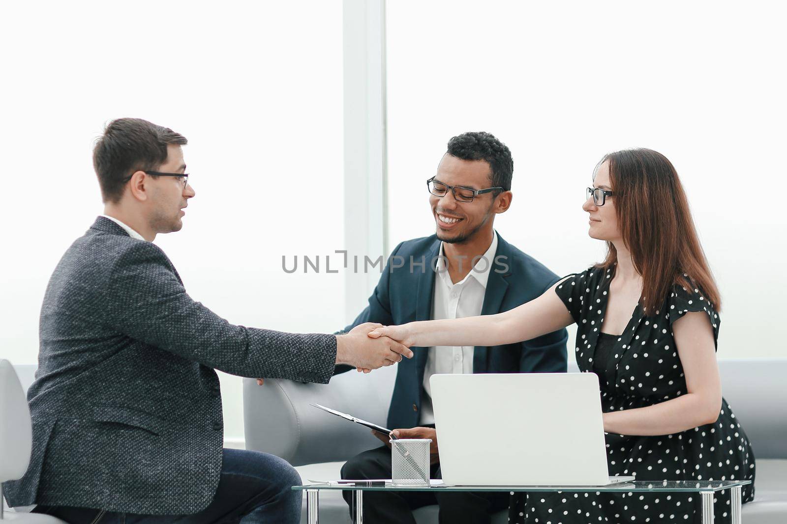 business partners shaking hands over the table negotiation . concept of cooperation