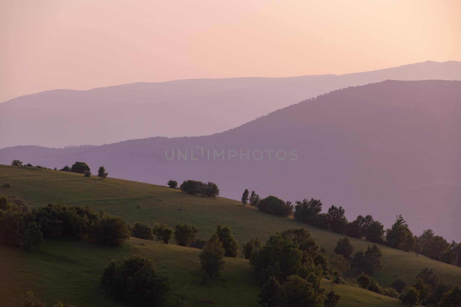 landscape of  summer nature in sunset in mountains and hills on countryside abstract lines and curves background