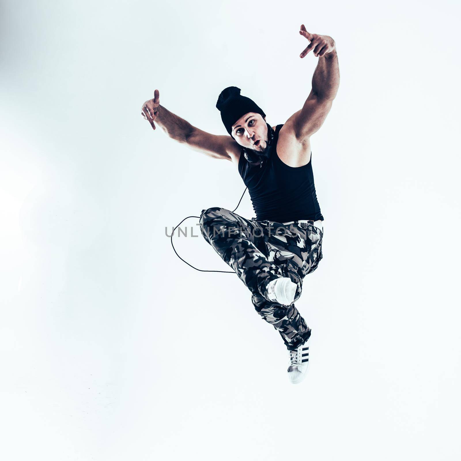 young rapper dancing break dance .photo on a white background. by SmartPhotoLab