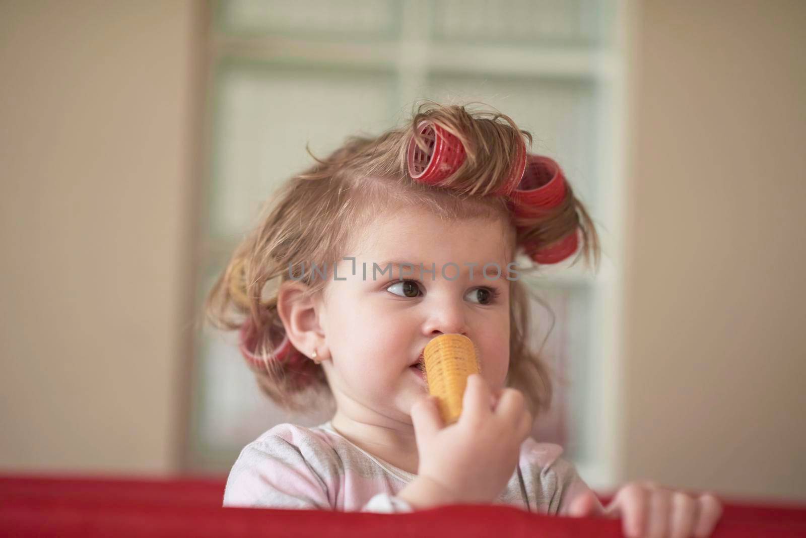 little baby girl with strange hairstyle and curlers by dotshock