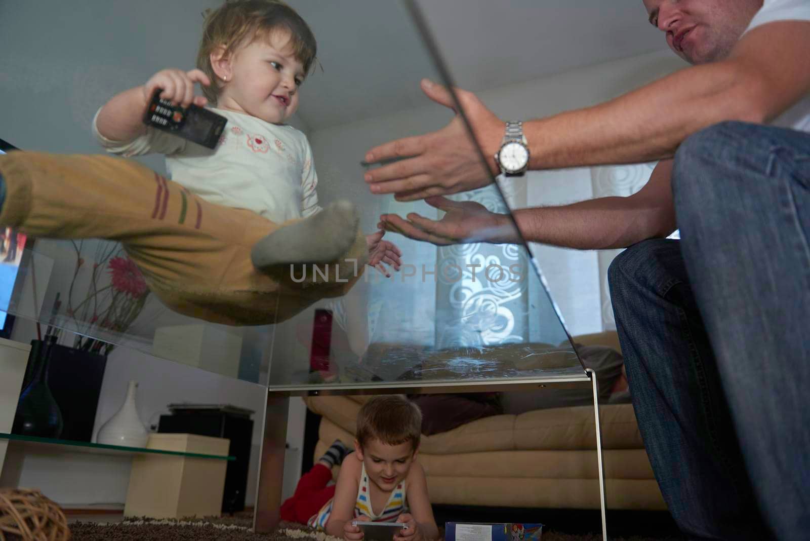 Little child playing at home with baby sister