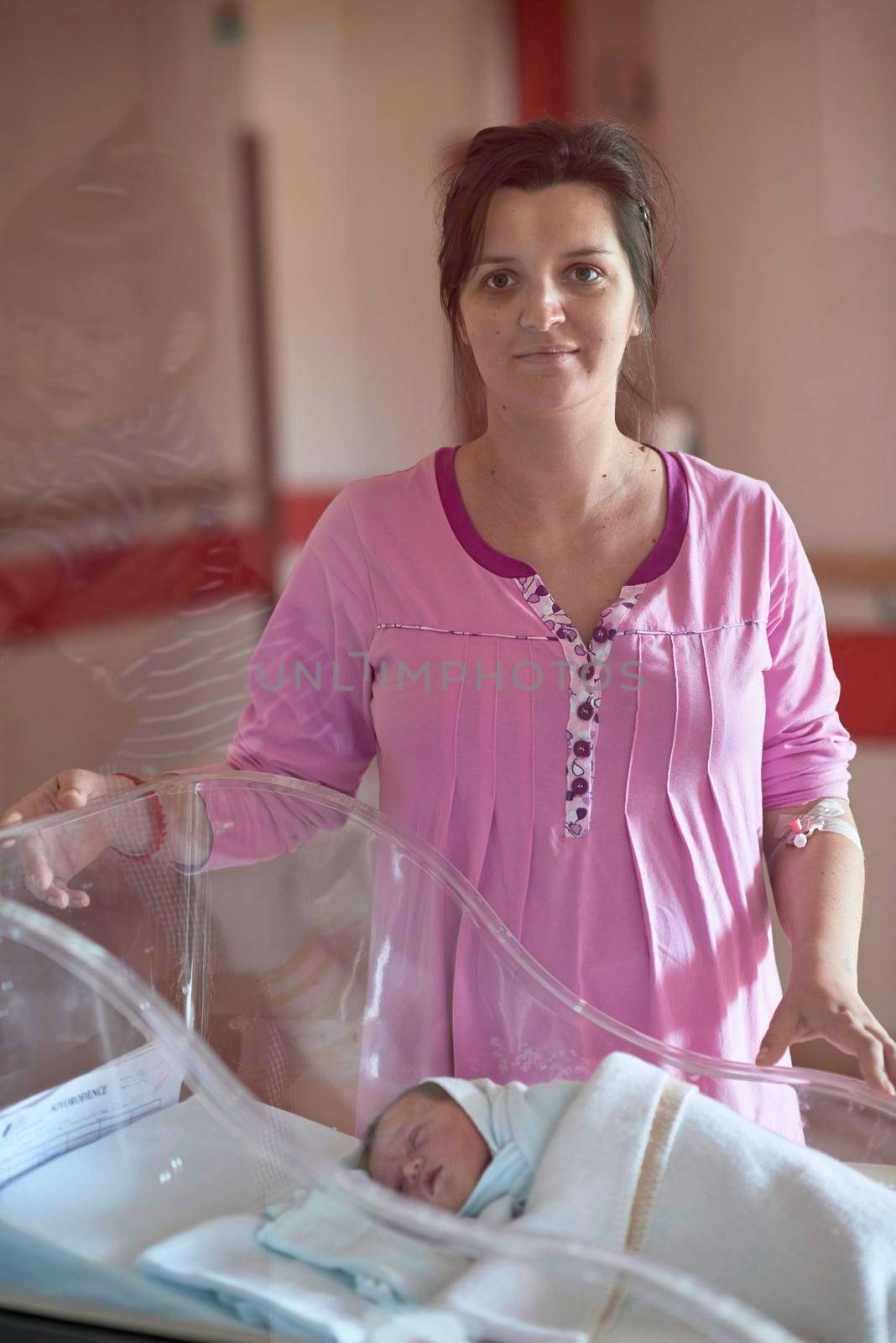 newborn baby girl and mother in hospital after birth