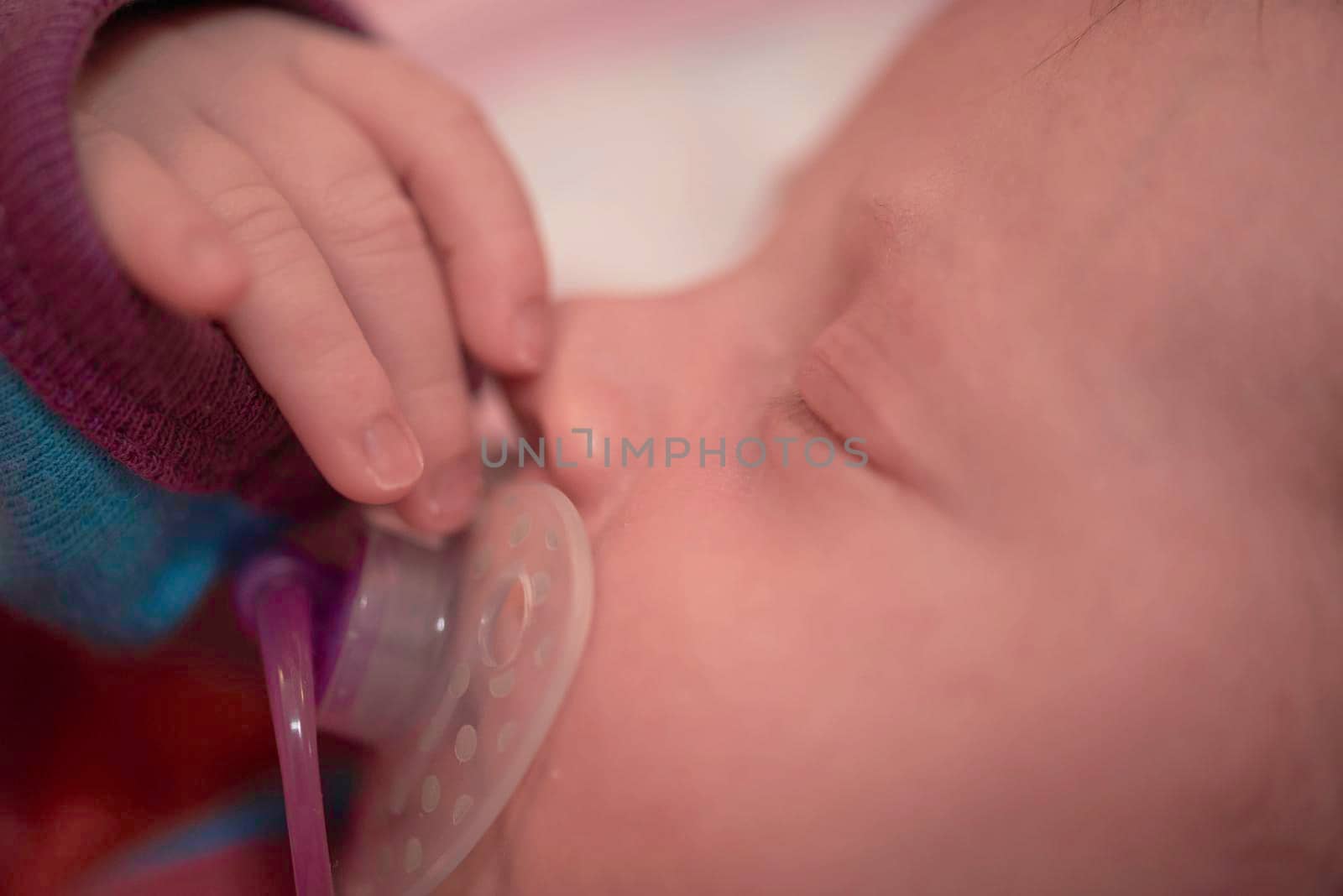 One month newborn baby in bed. Close up portrait of sleeping cute little girl