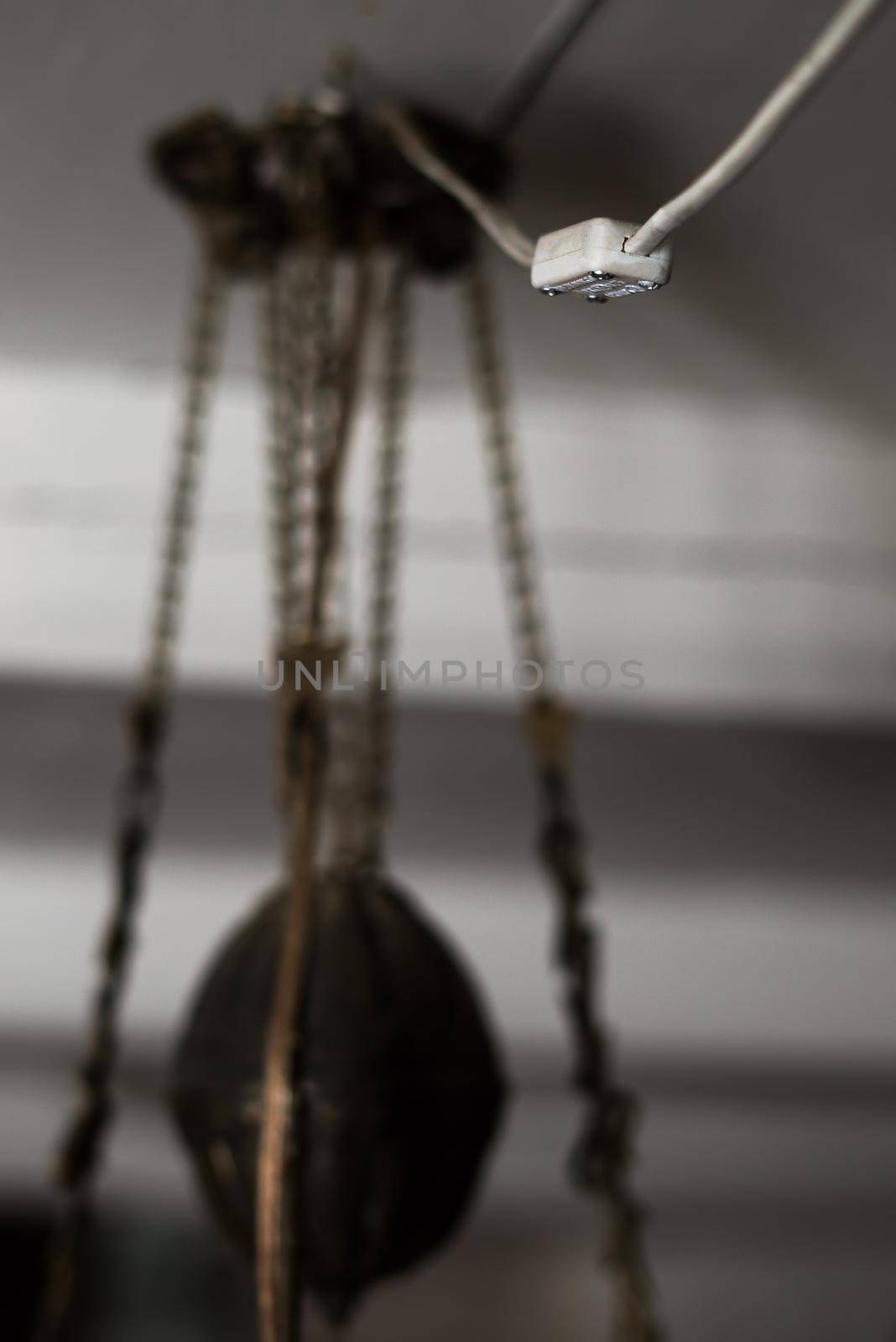 Light switch and old lamp hanging from the ceiling by h.angelica_corneliussen
