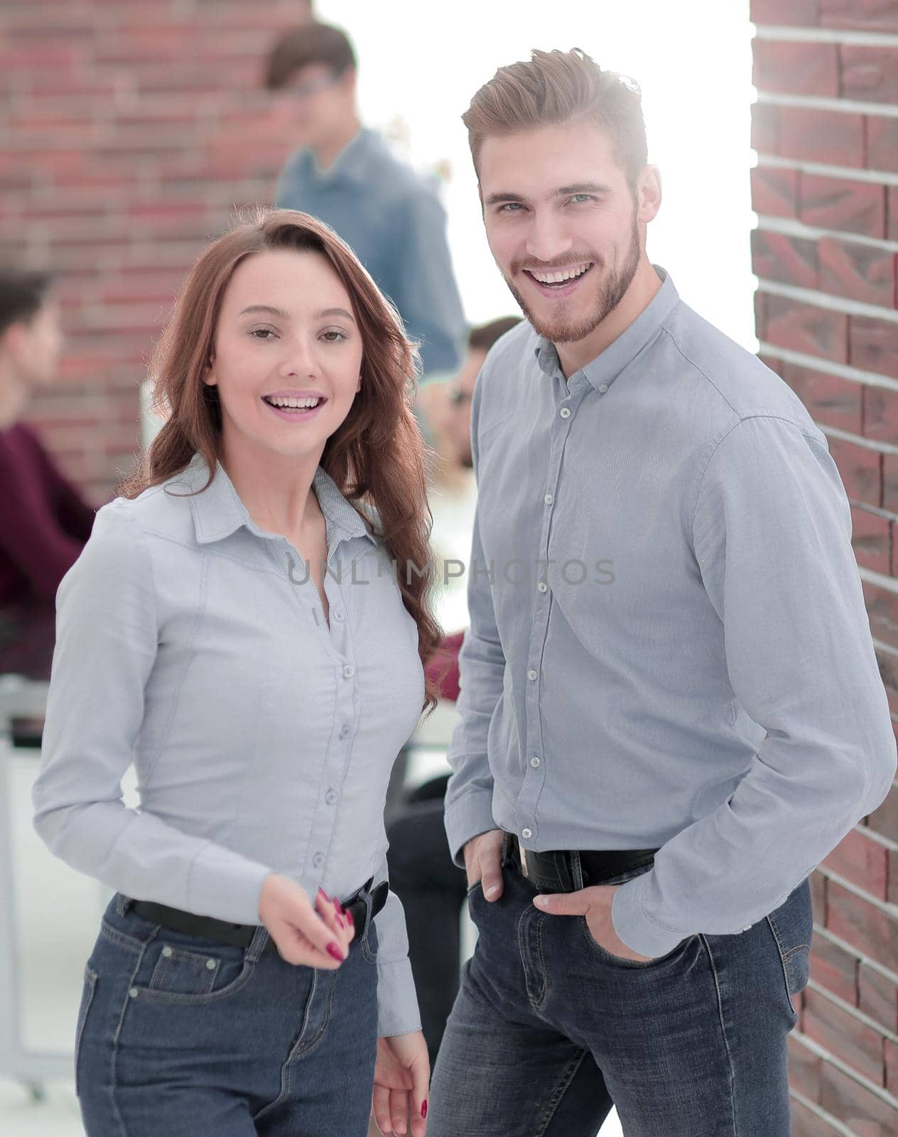 Smiling business people attending work meeting