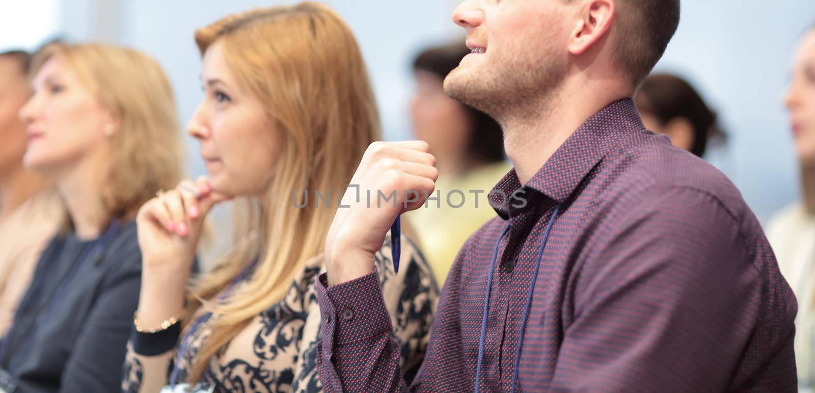 close up. young entrepreneurs at a business conference. by SmartPhotoLab