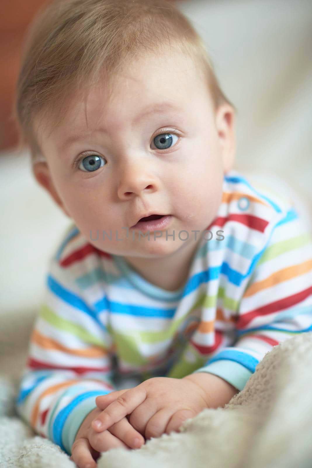 cute  little newborn baby smilling  at home