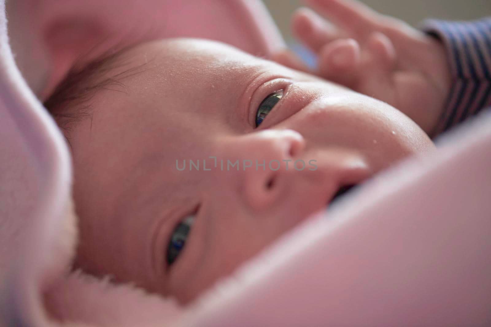 One month newborn baby sleeping  in bed by dotshock