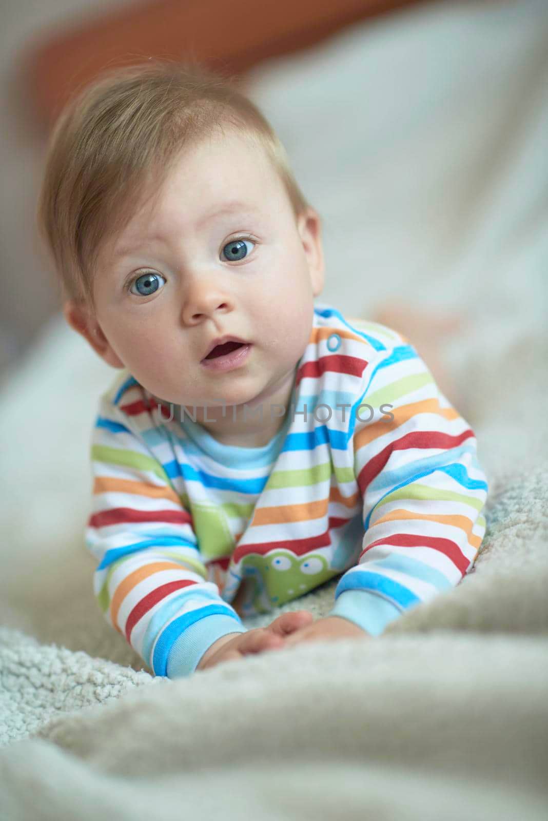 cute  little newborn baby smilling  at home