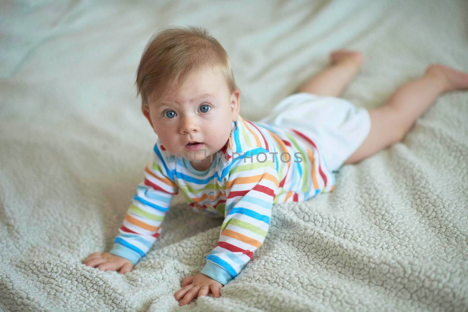 cute  little newborn baby smilling  at home