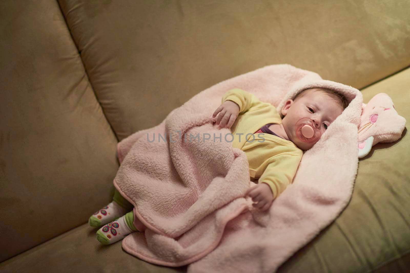 newborn baby sleeping  at home in bed by dotshock
