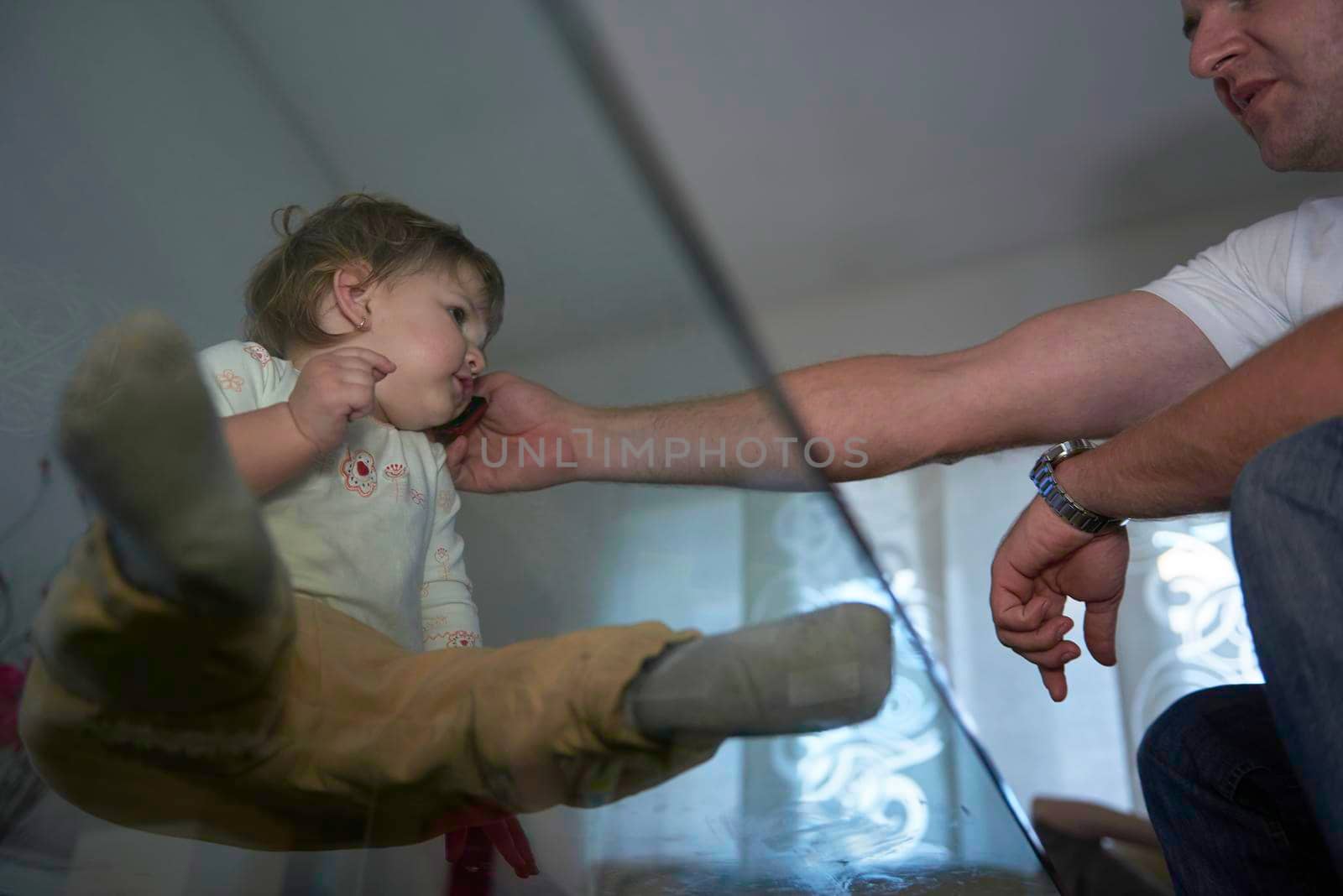 Little child playing at home with baby sister