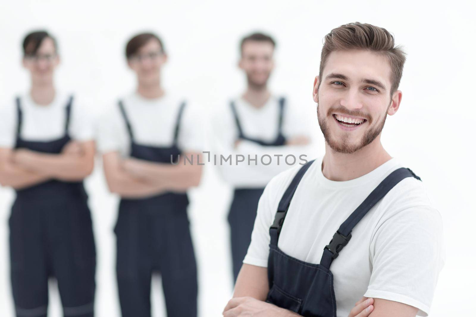 Cheerful team of responsible movers isolated on white background by asdf