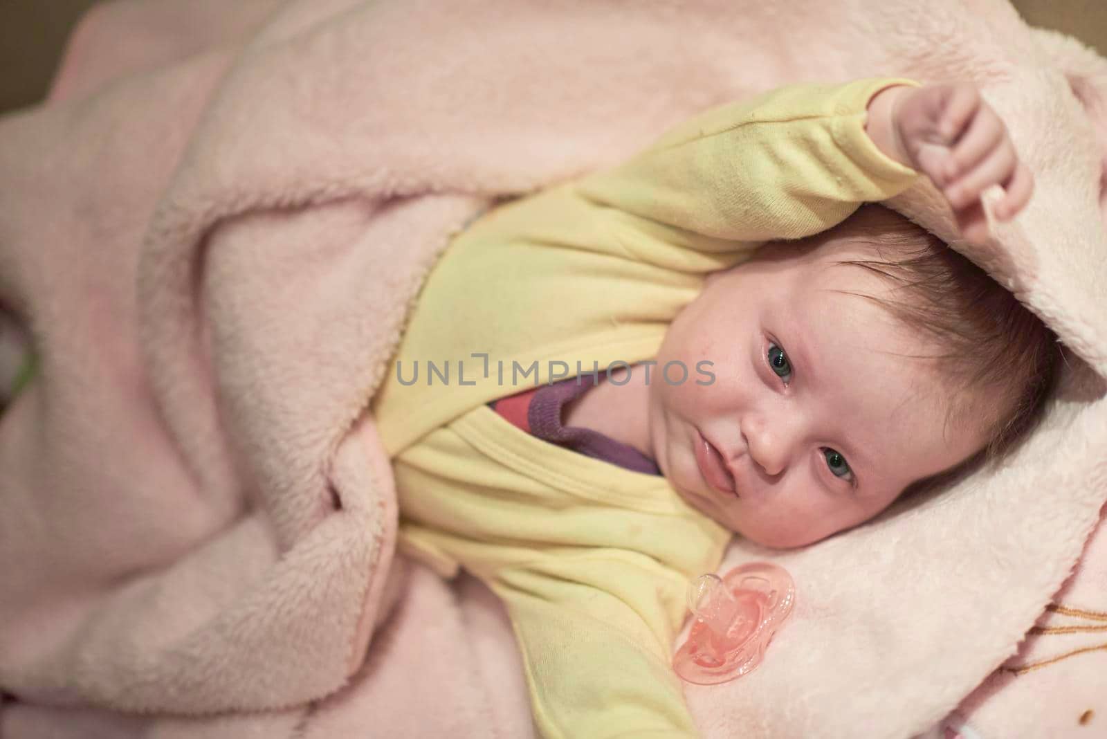 cute  little newborn baby smilling  at home