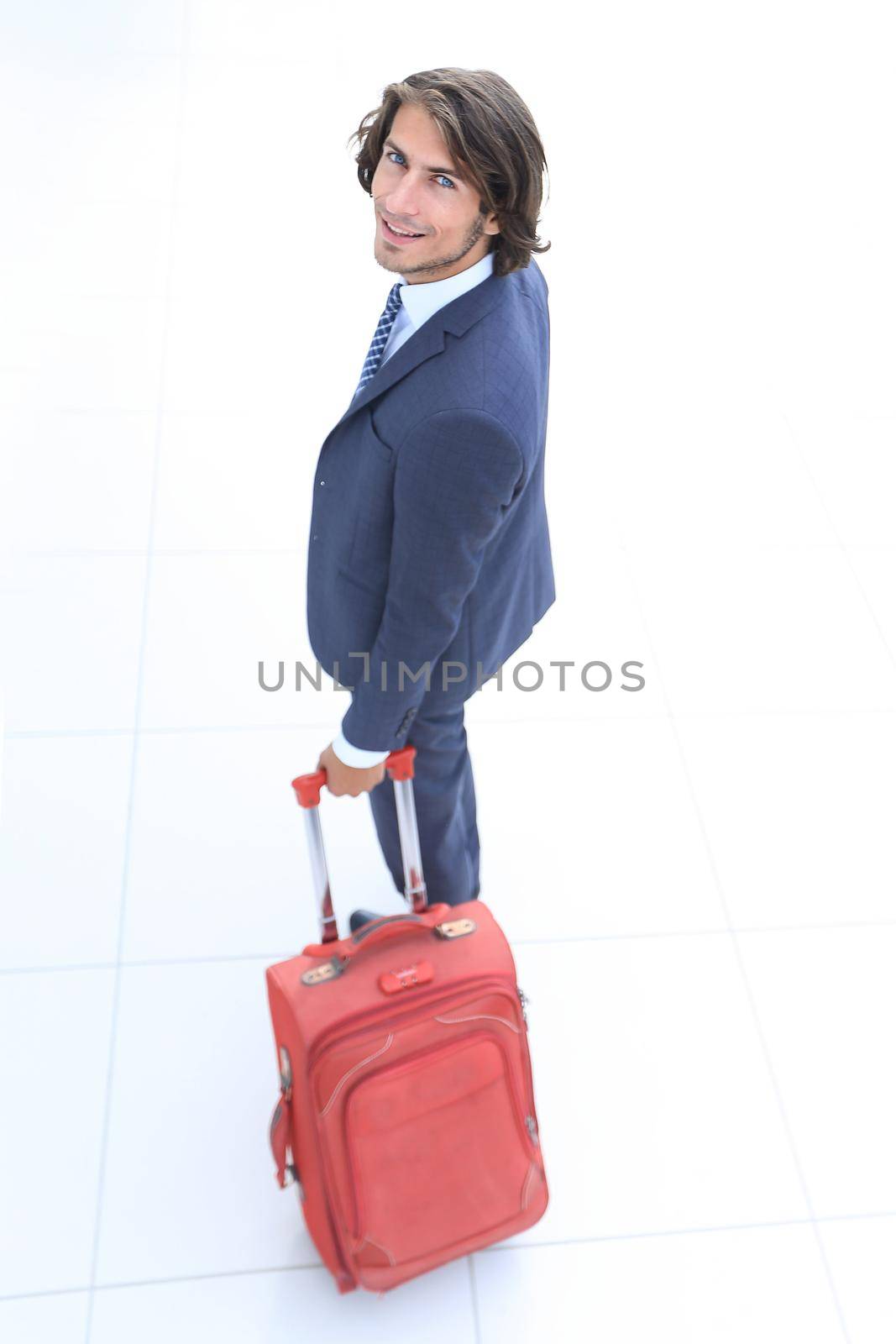 top view and rear.businessman with travel suitcase goes out.photo with copy space.