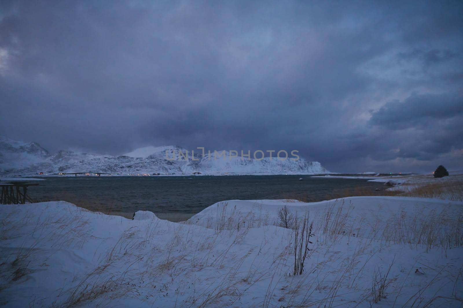 norway coast in winter with snow bad cloudy weather by dotshock