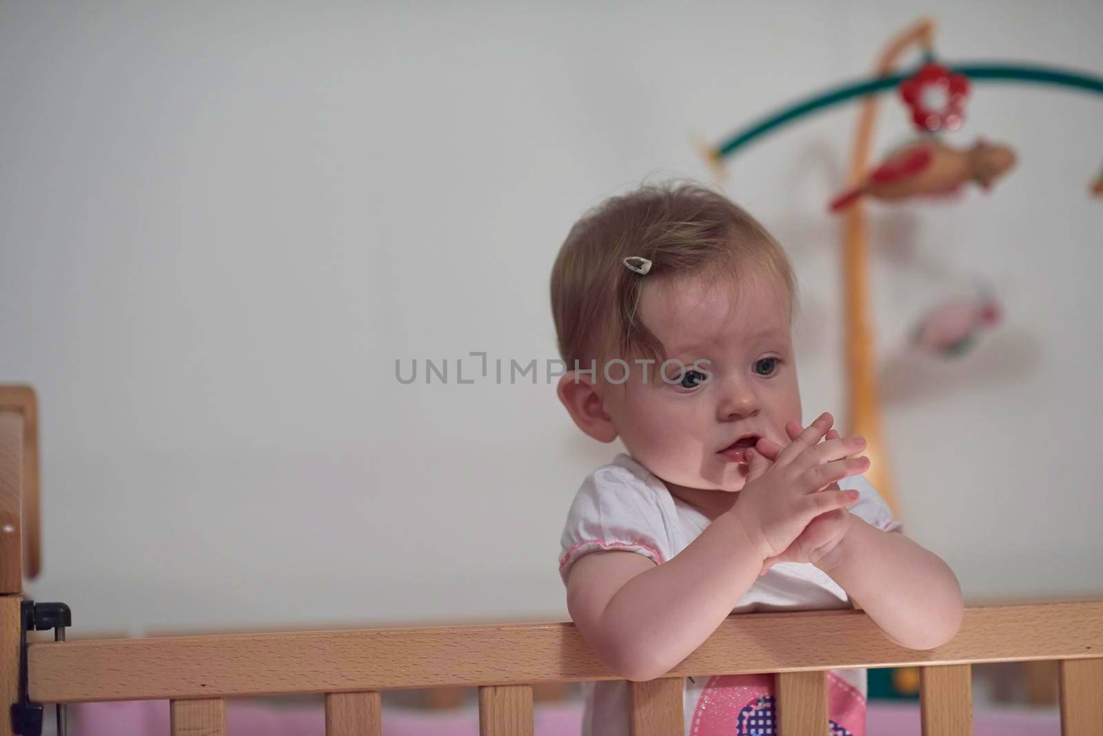 cute  little one year old baby and making first steps in bed by dotshock