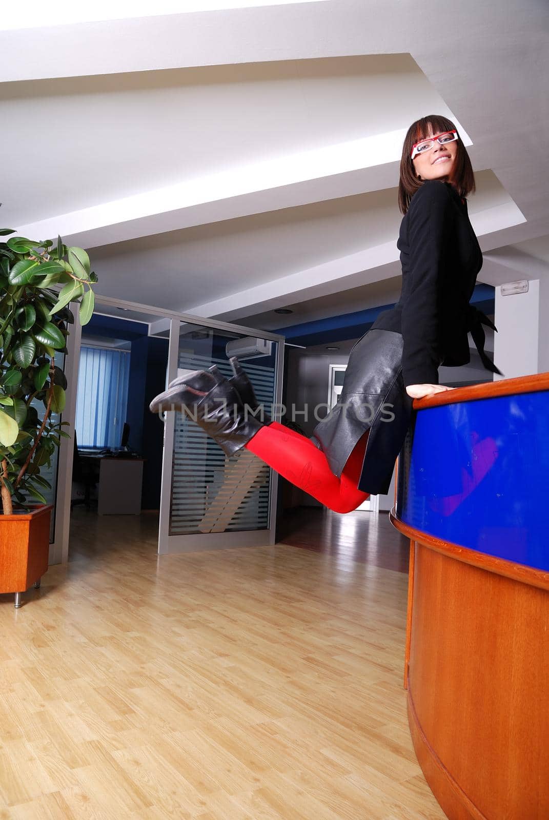 Businesswoman jumping by dotshock