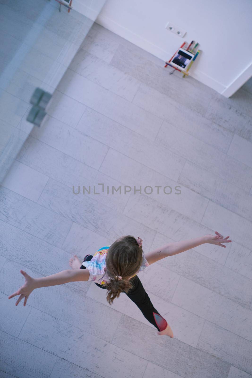 girl online education ballet class at home top view by dotshock