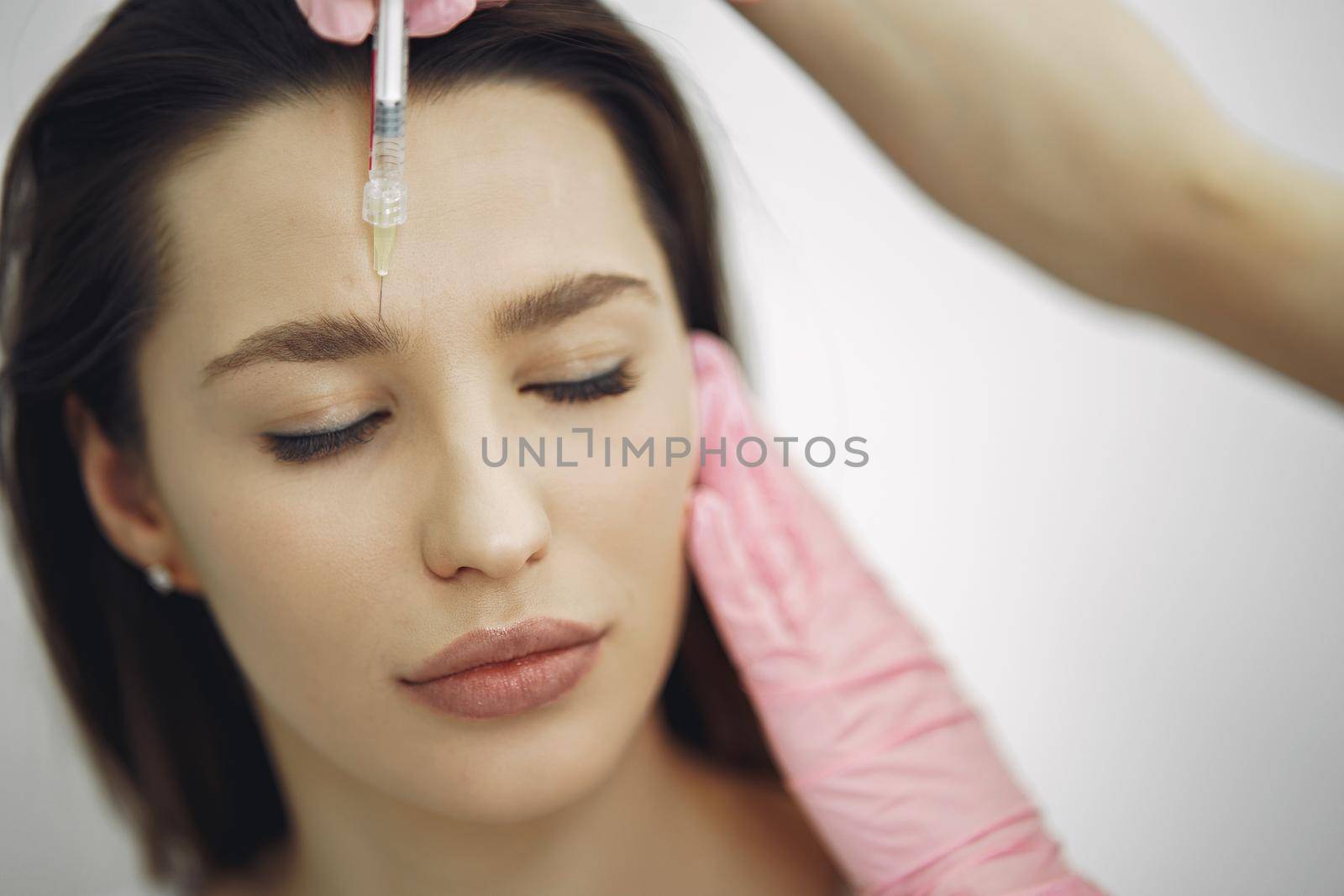 Woman with a doctor in cosmetology studio by prostooleh