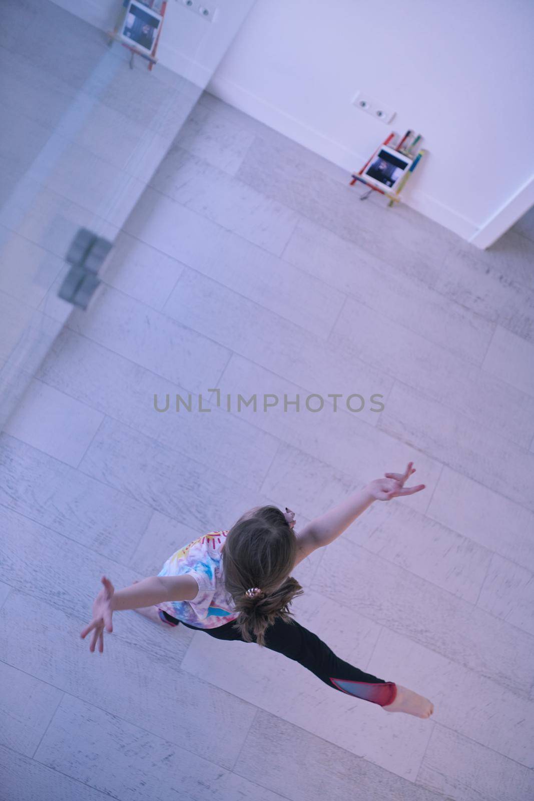 girl online education ballet class at home top view by dotshock