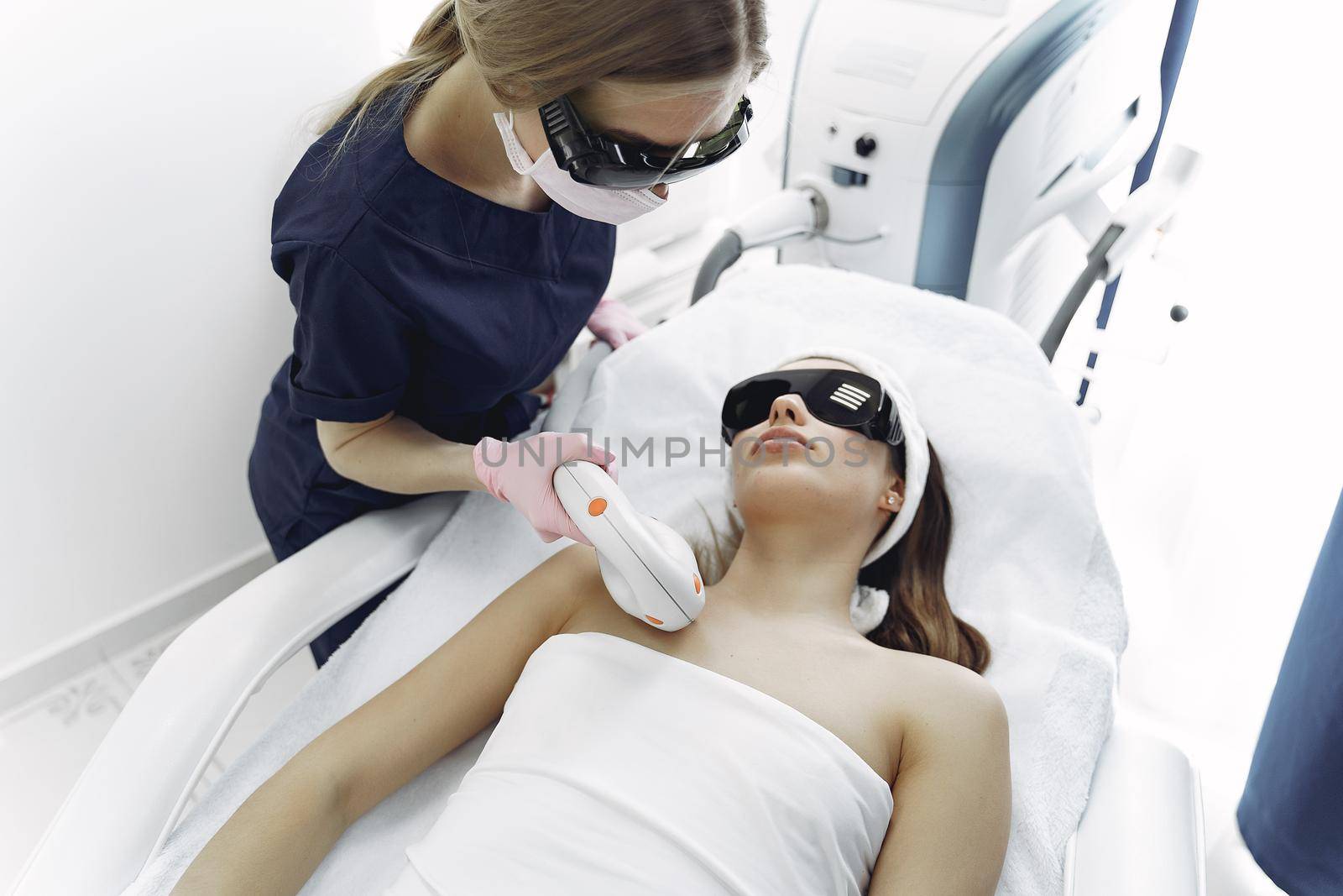 Woman in cosmetology studio on laser hair removal by prostooleh