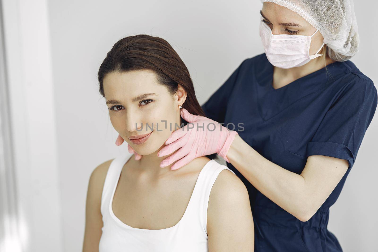 Woman with a doctor in cosmetology studio by prostooleh
