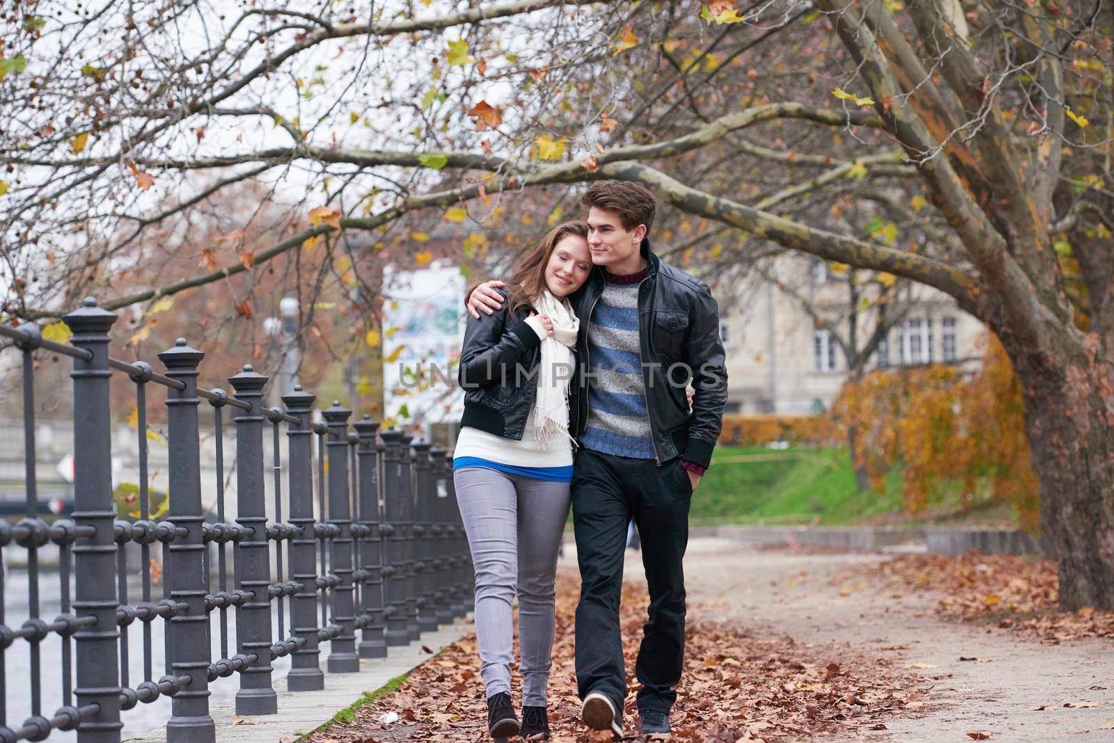 romantic young couple have fun in city park at autumn season
