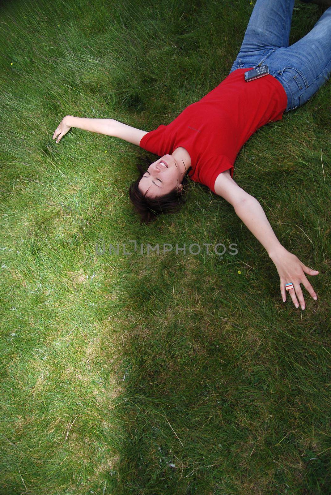 woman laying in grass   (NIKON D80; 2.6.2007; 1/800 at f/3.5; ISO 320; white balance: Auto; focal length: 18 mm)