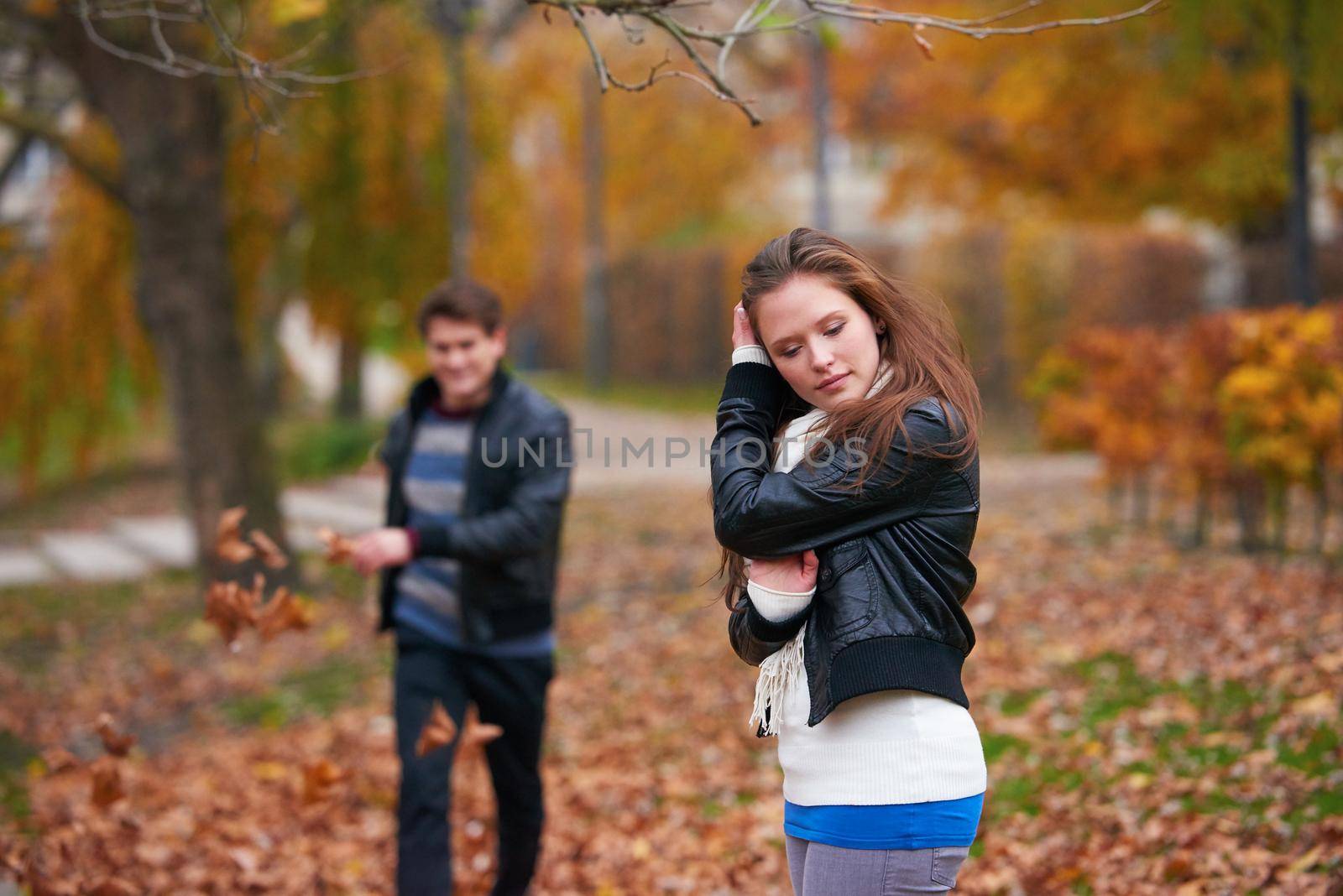 romantic young couple have fun in city park at autumn season