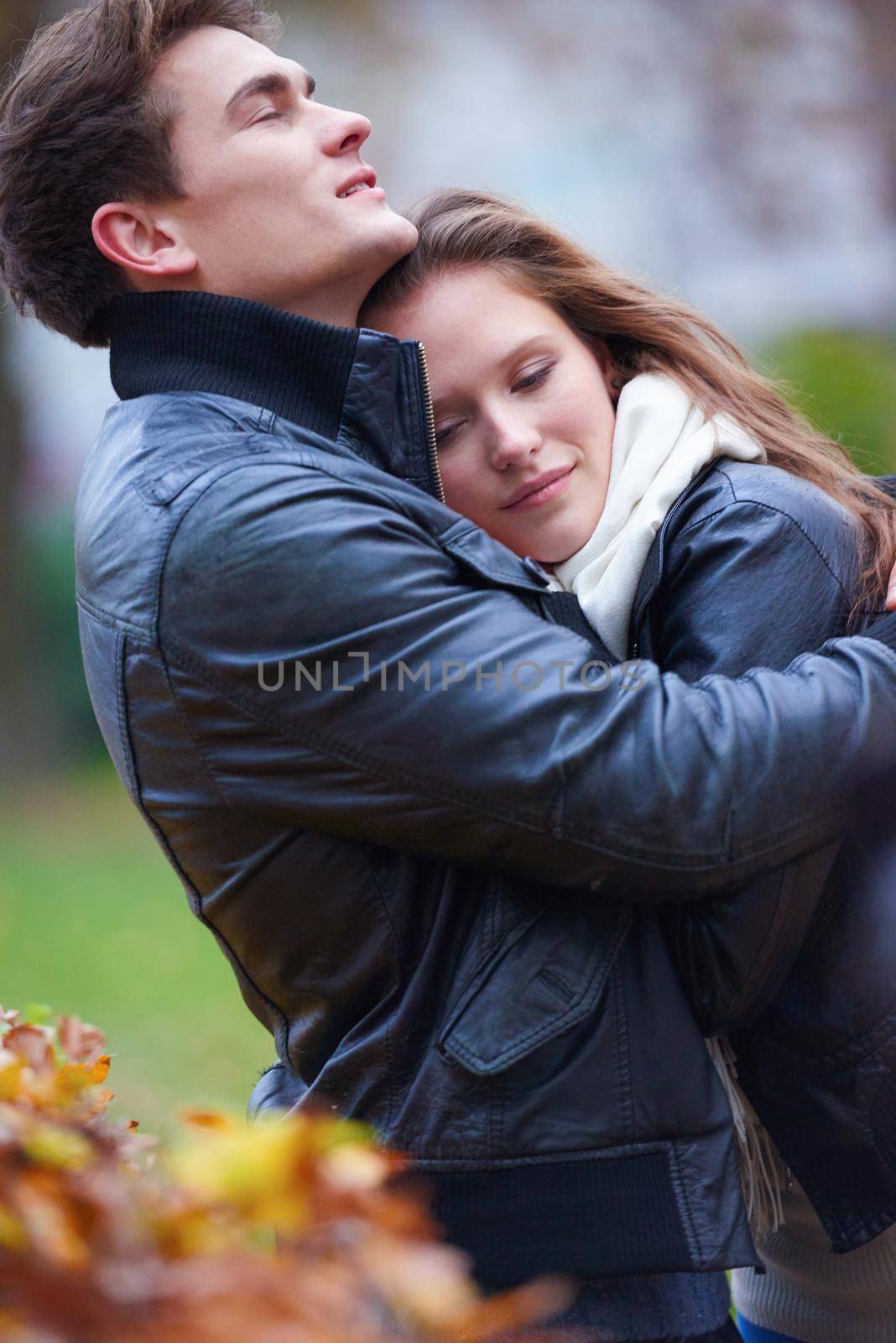 romantic young couple have fun in city park at autumn season