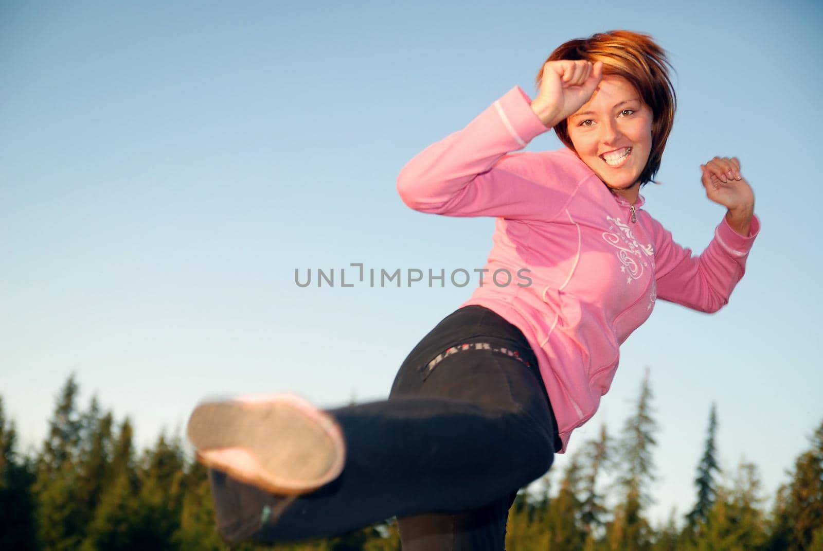 pretty girl doing exercise in nature by dotshock