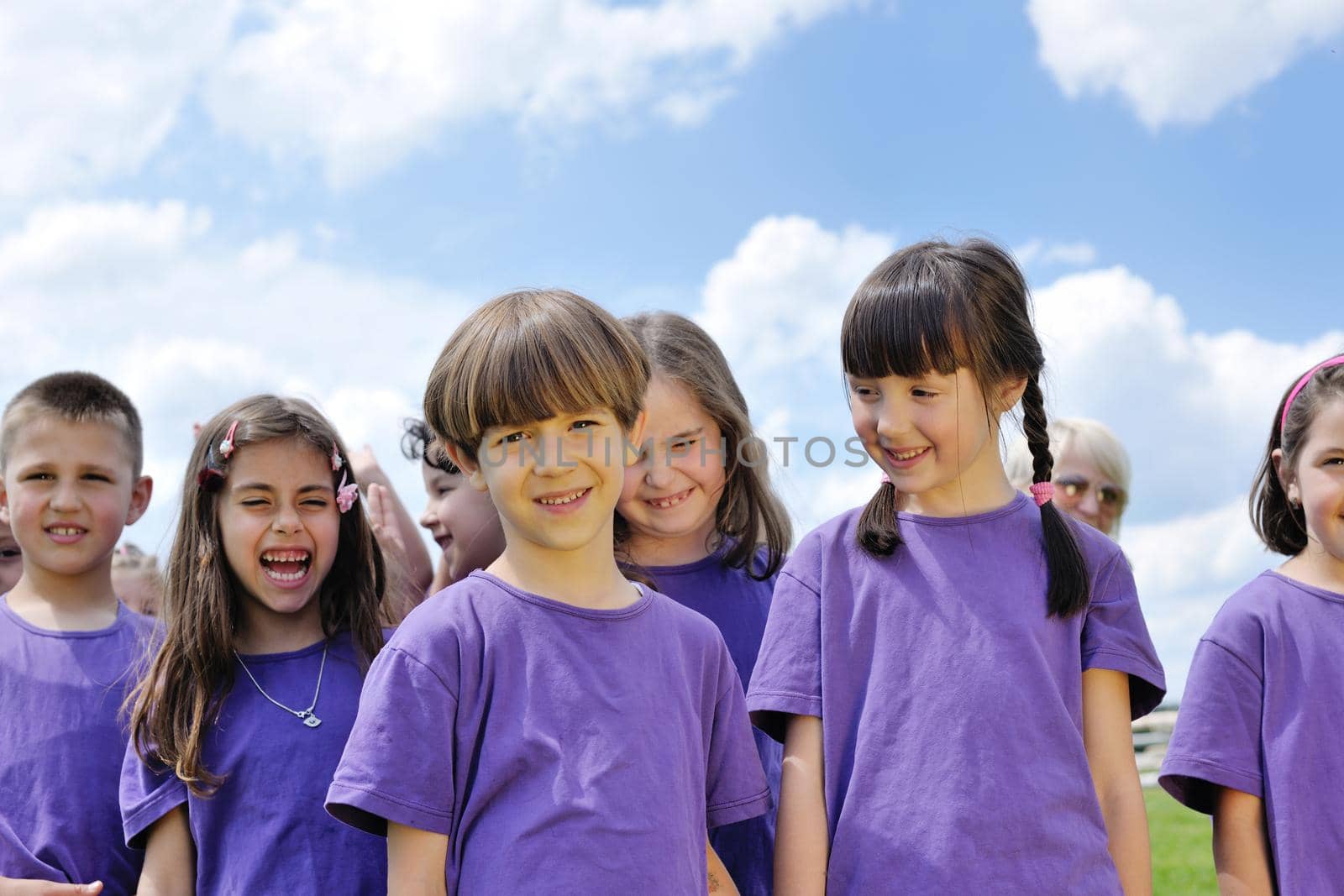 happy kids group have fun in nature outdoors park