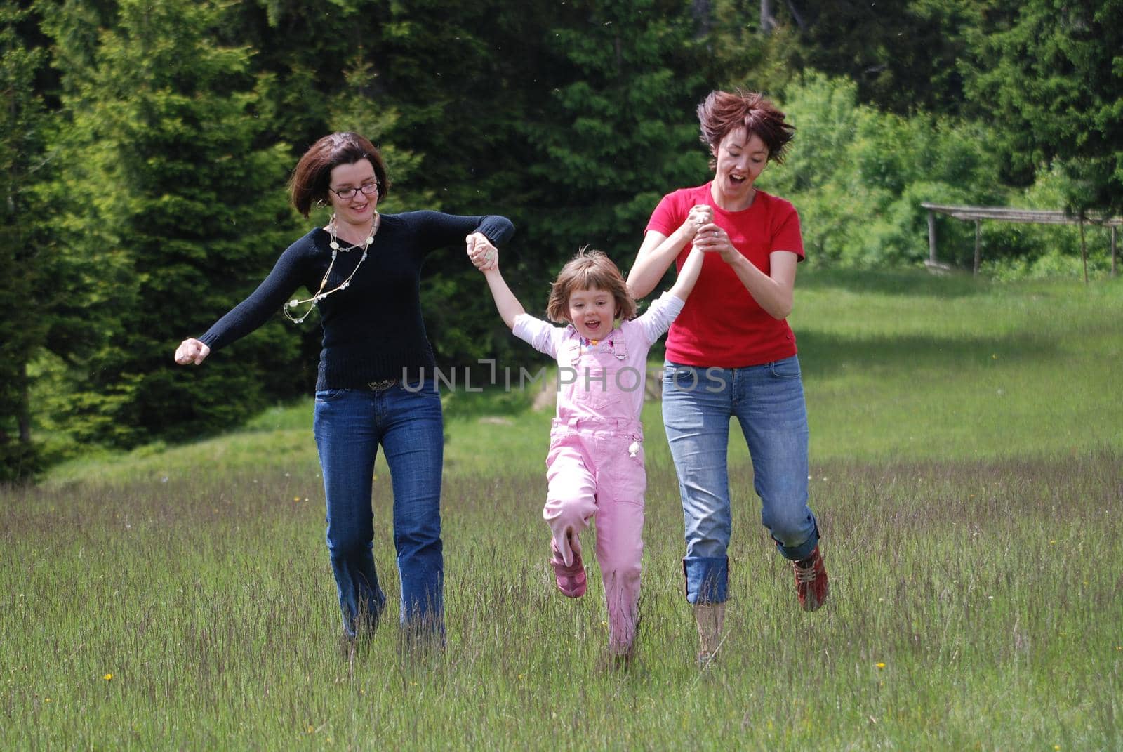 happy girls running in nature by dotshock