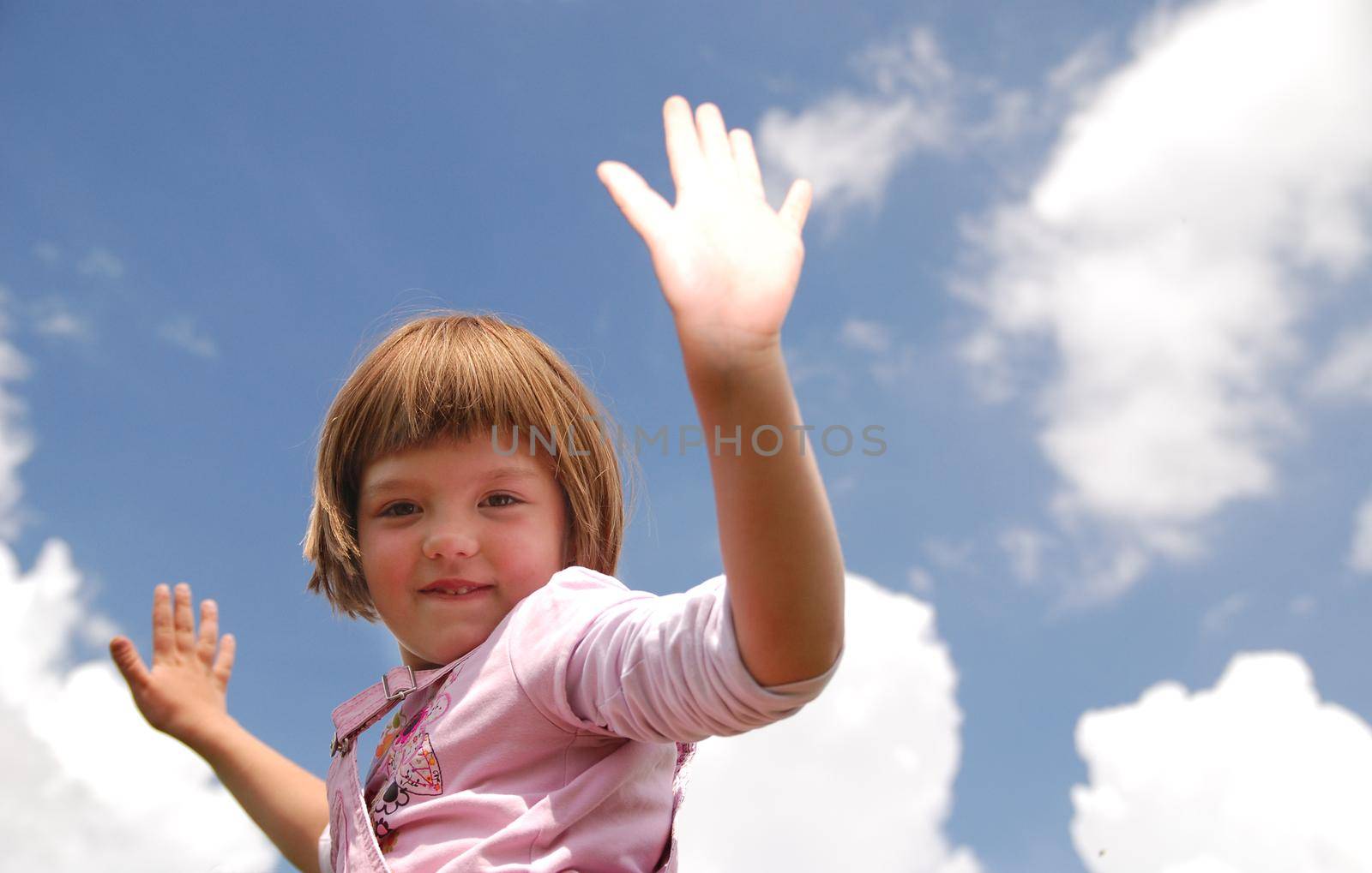 girl with arms wide open and sky background (Multiple values)