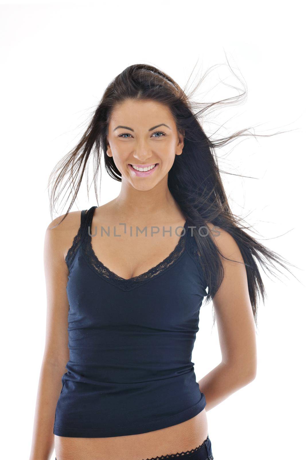 fashion beauty shoot with happy young girl isolated on white with wind in hair  in studio