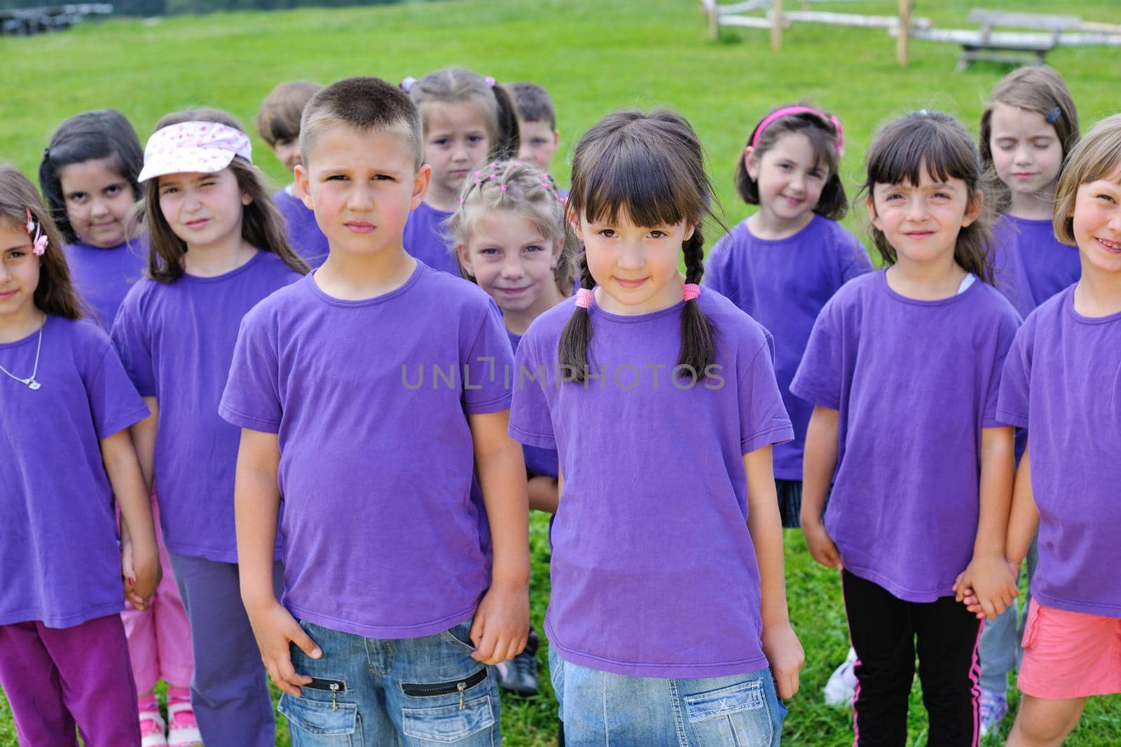 happy kids group have fun in nature outdoors park